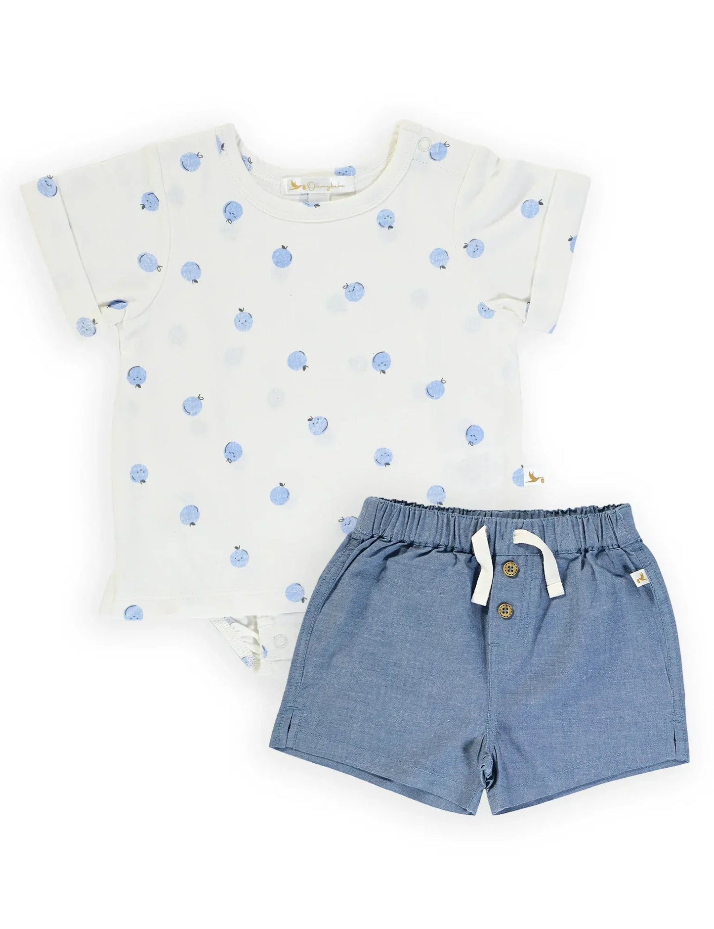 Baby outfit with organic white bodysuit featuring blue apple print and elastic waist blue shorts