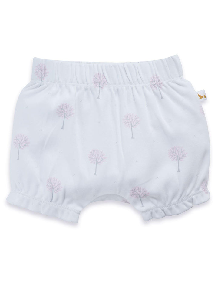 Soft white organic cotton baby bloomers with an elasticated waist and a delicate winter tree print. Features a cute ruffled leg opening. Buy comfortable baby bottoms India.