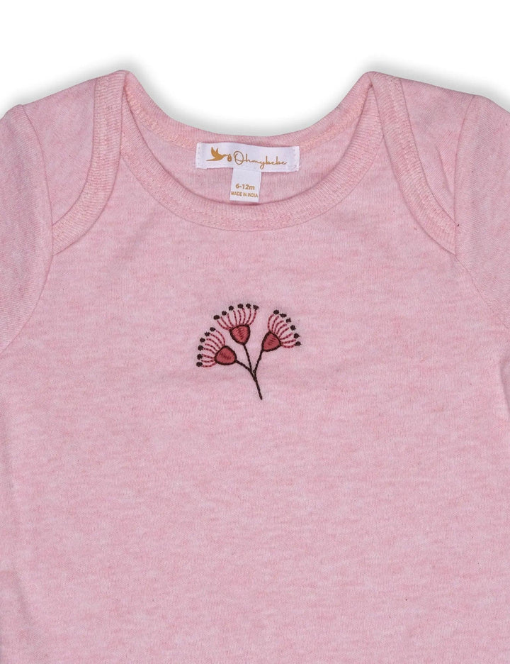 Close-up of the 100% organic cotton long-sleeve bodysuit in a soft pink melange with a delicate floral embroidery. Part of a 3-piece set. Buy online India.