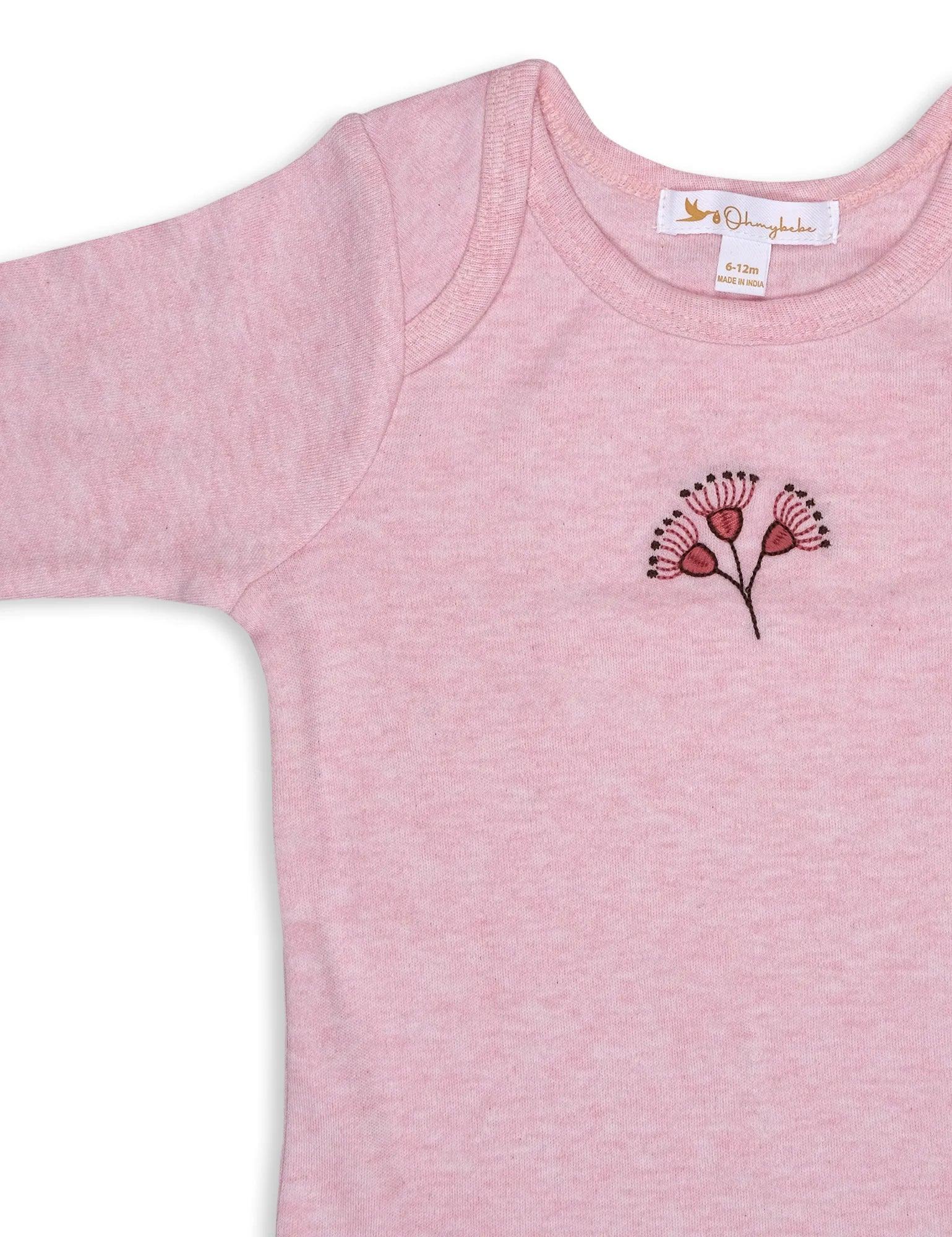 Pink organic cotton baby bodysuit with embroidered floral design, size 6-12 months