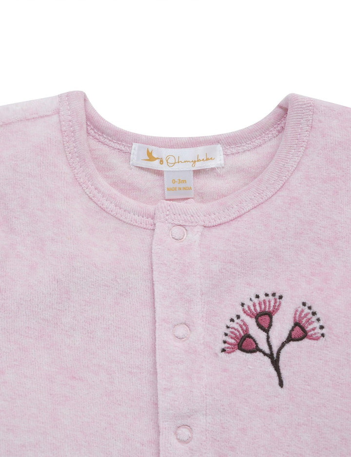 Light pink organic cotton baby cardigan with long sleeves, a button-down front, and a charming eucalyptus blossom embroidery on the chest. Shop gentle baby cardigans India.