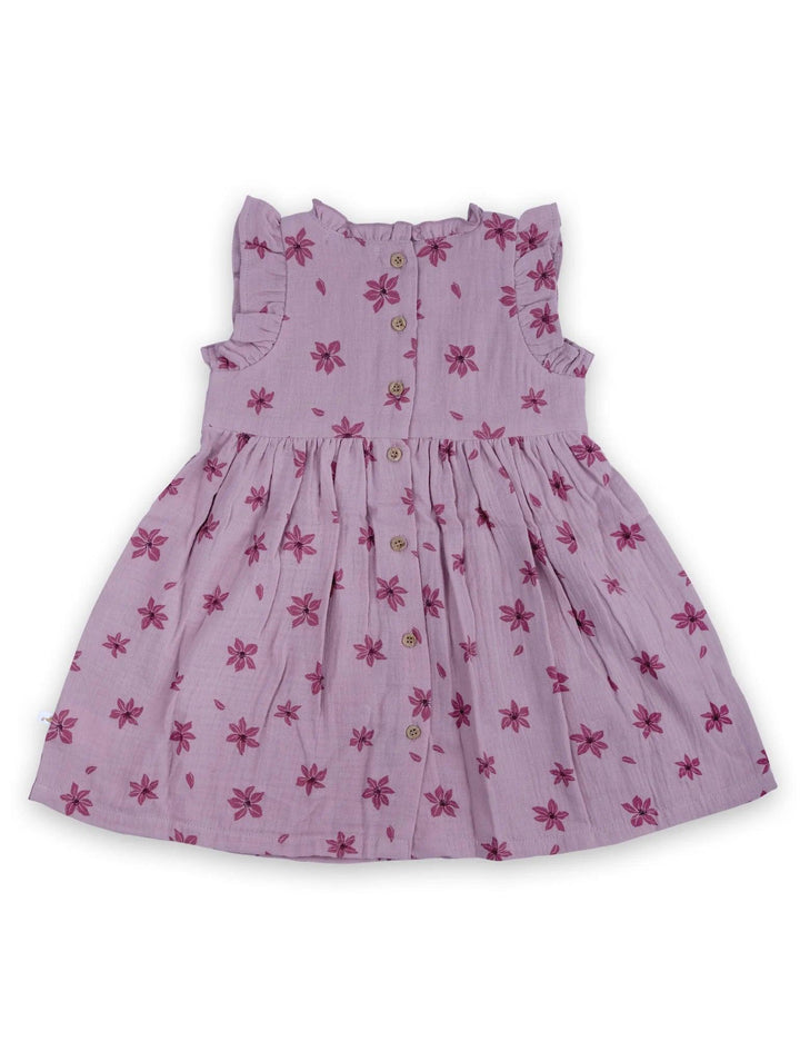 Back view of the lilac organic cotton baby dress showing the button closure and the pretty dark pink floral print. See details of organic baby dresses India.