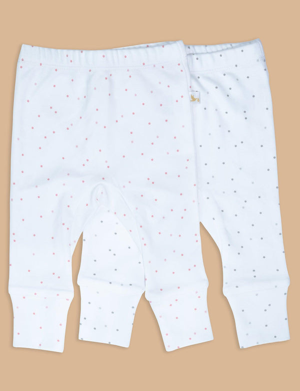 Two pairs of soft organic cotton baby leggings in white with a pattern of small grey dots and small pink dots. Shop comfortable baby pants India.