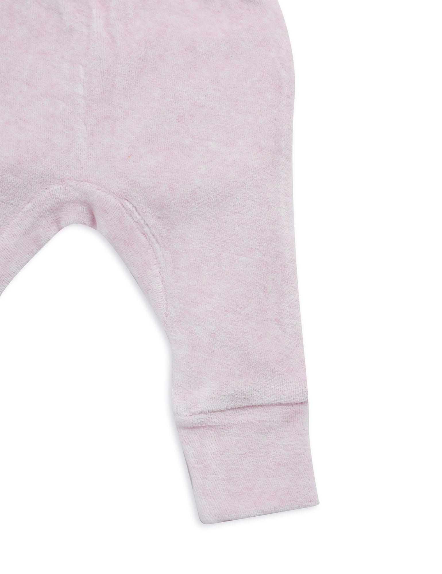 Close-up of light pink organic cotton baby pants leg and cuff detail