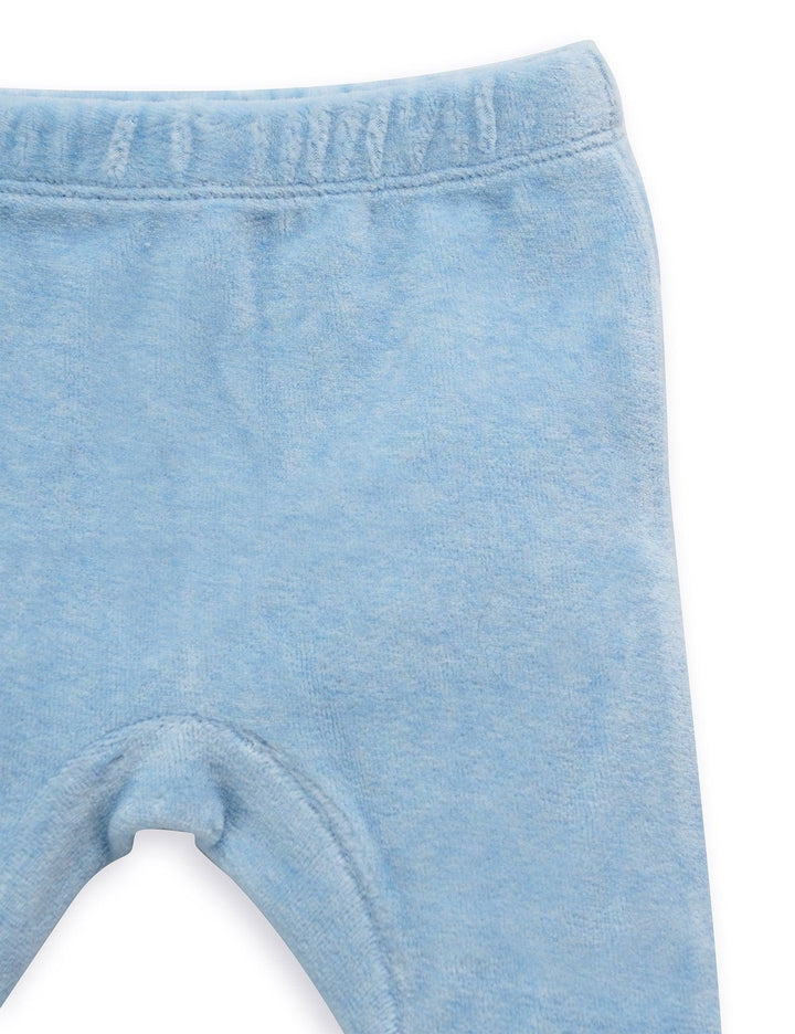  Detail of the soft blue organic cotton baby pants showing the gentle elastic waistband for a comfortable fit. See comfortable baby wear India.