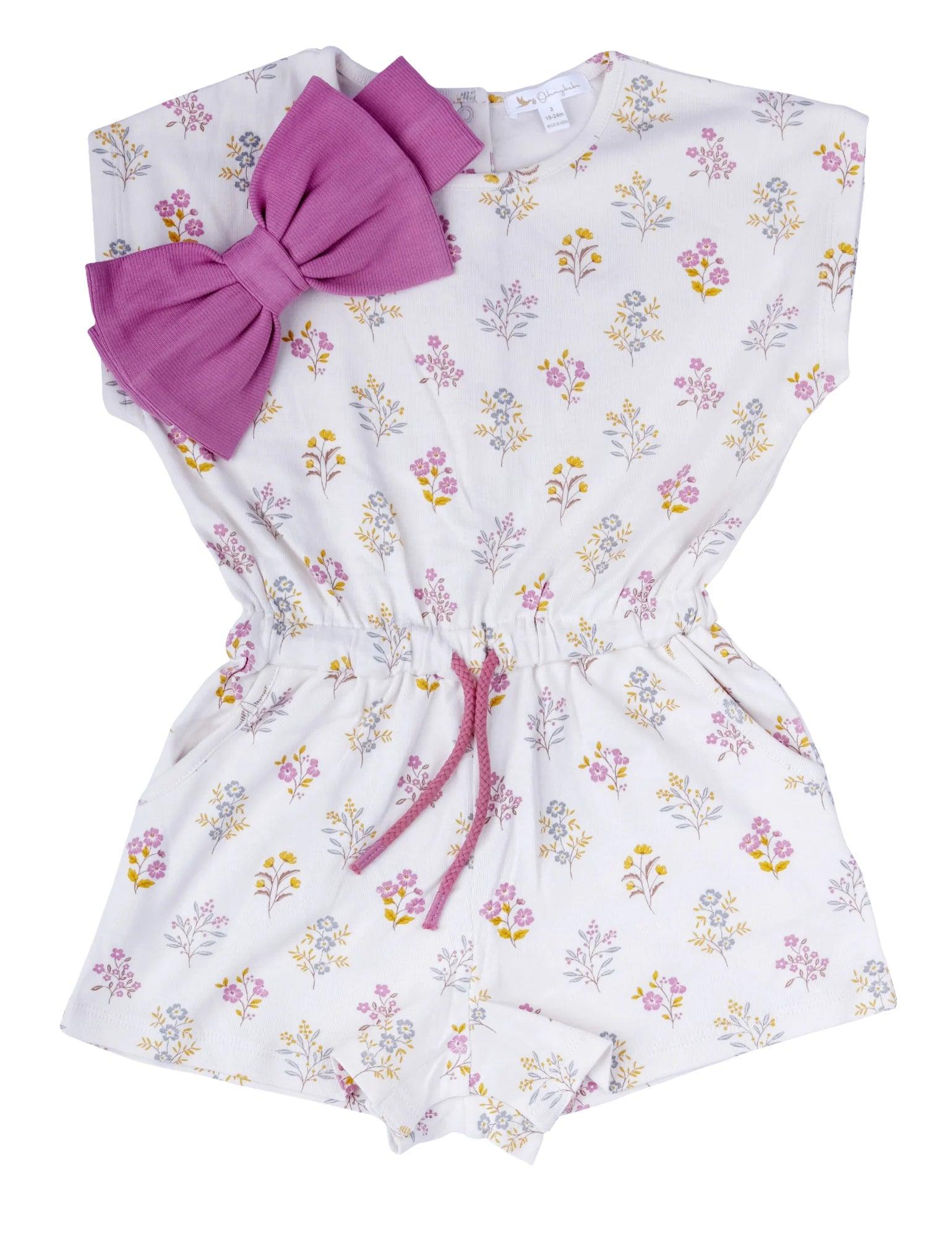 Organic cotton baby romper with floral print and attached pink bow for girls