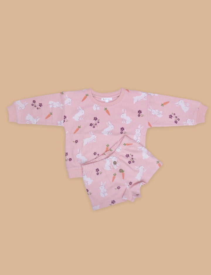 Adorable pink 100% organic cotton baby sweatshirt with a playful bunny, carrot, and floral print, paired with matching shorts. Buy organic baby sets online India.