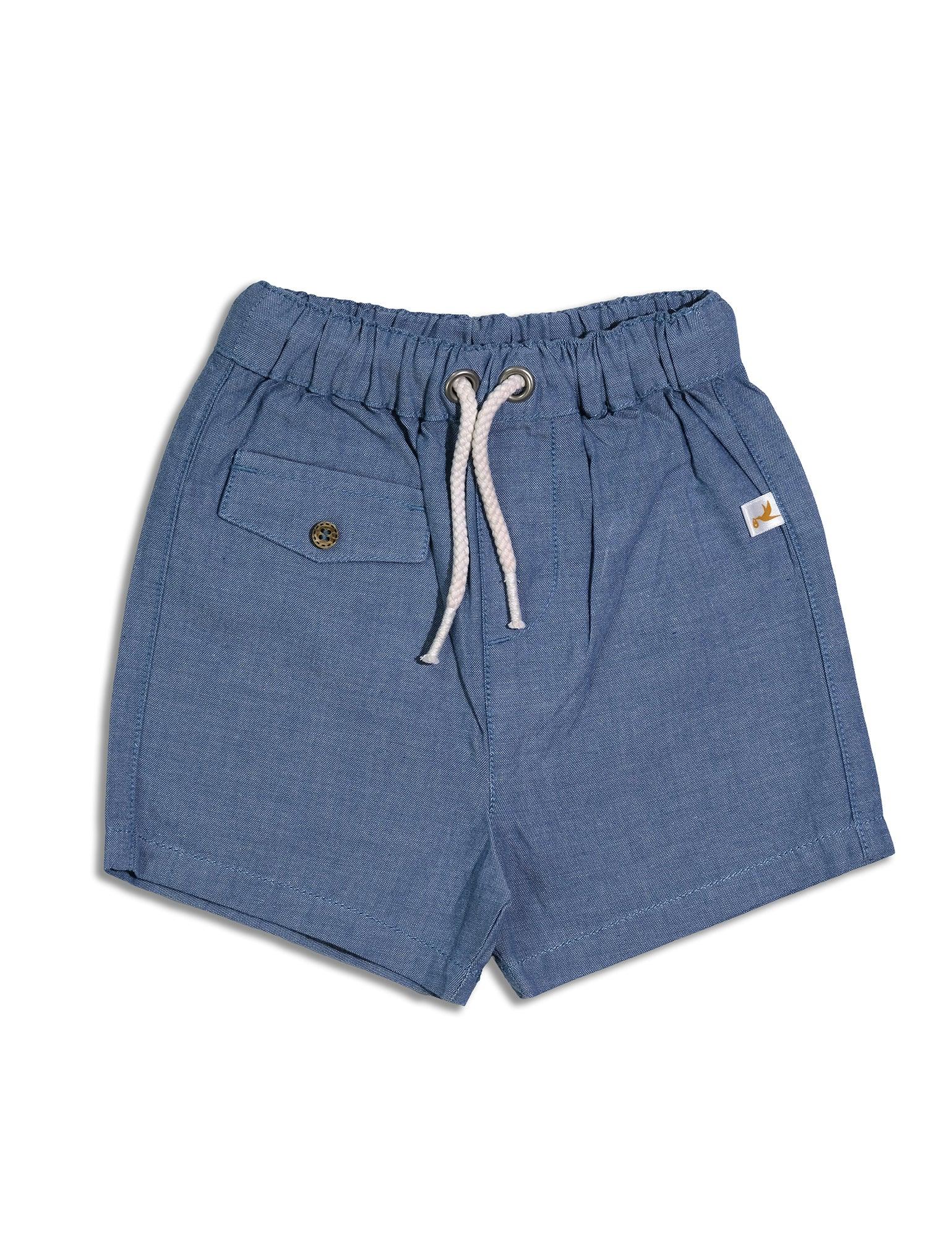 Blue organic cotton baby shorts with elastic waistband, white drawstring, and buttoned side pocket