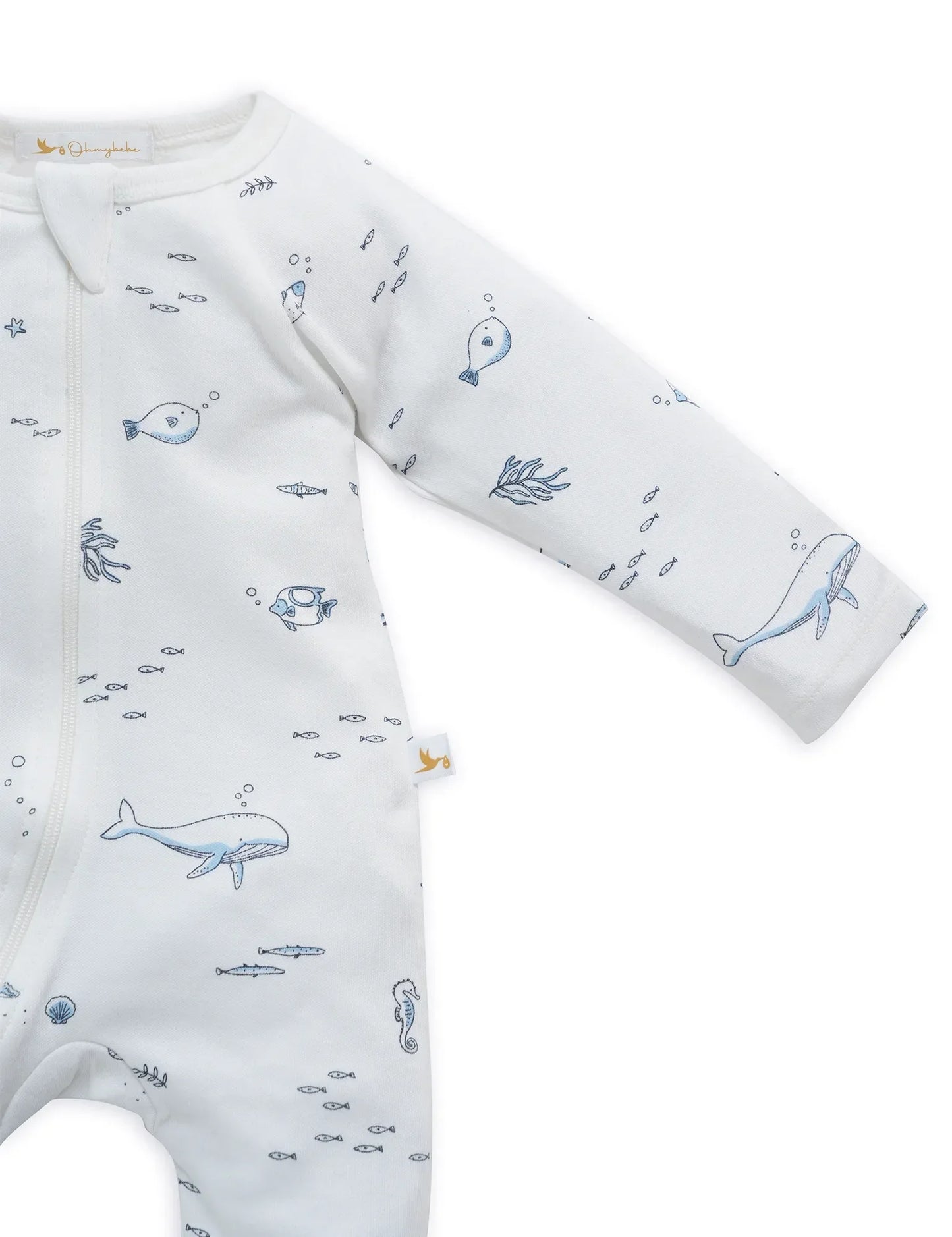 Organic cotton baby sleepsuit with nautical-themed blue sea creature and fish print on white fabric