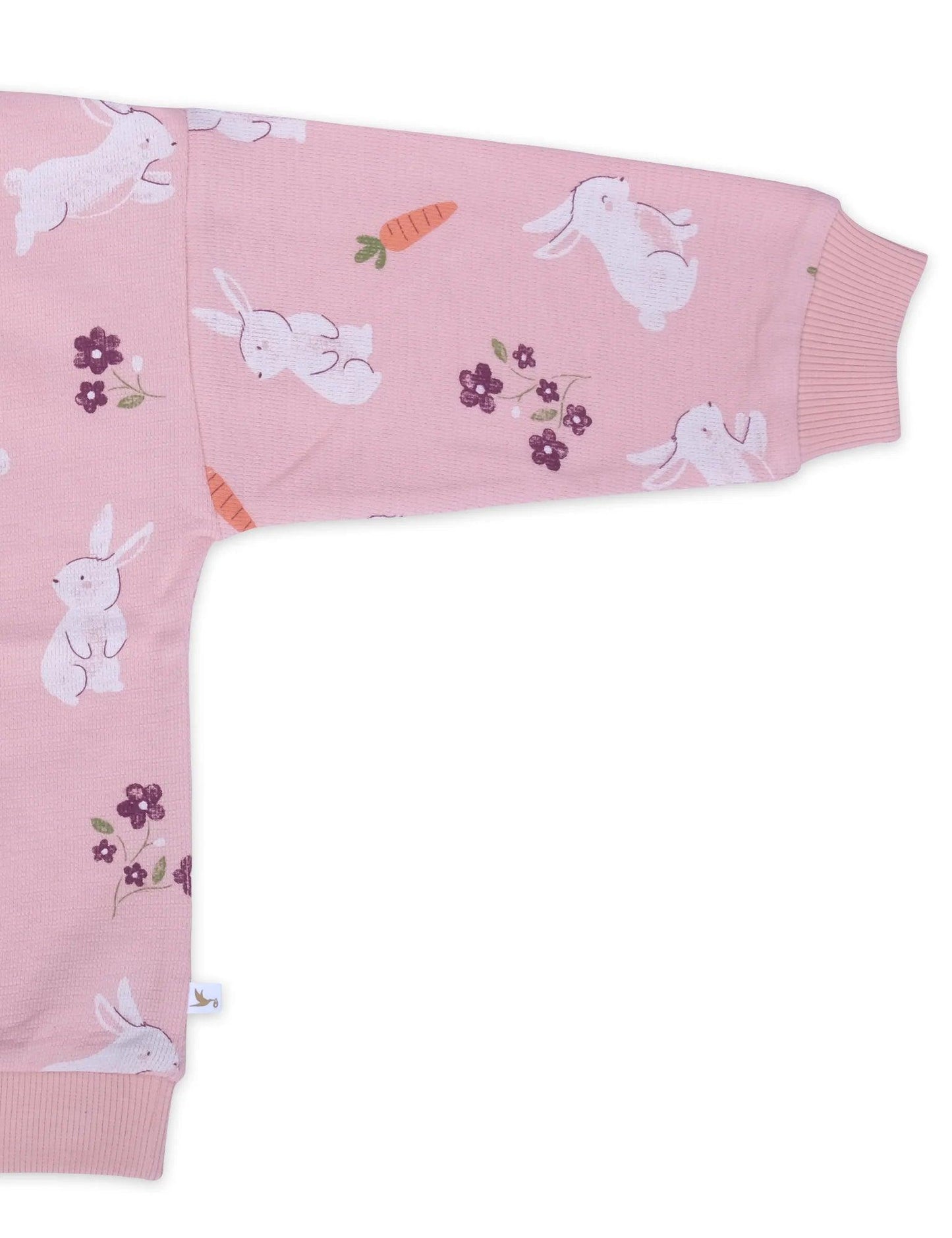 Pink organic cotton baby sweatshirt sleeve with white bunny, carrot, and purple flower print