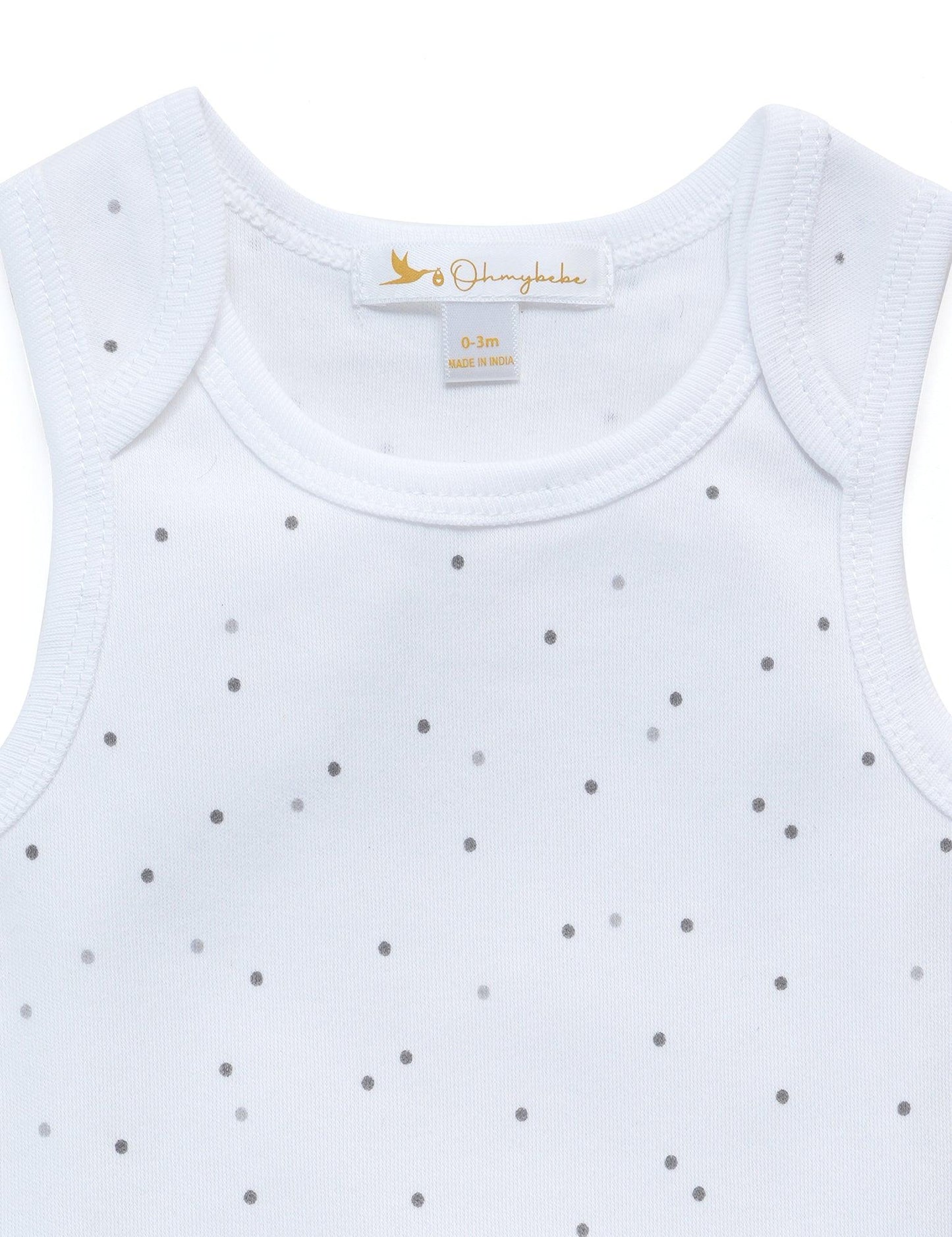 White baby tank top with gray polka dots and Ohmybabe neck label, size 0-3 months