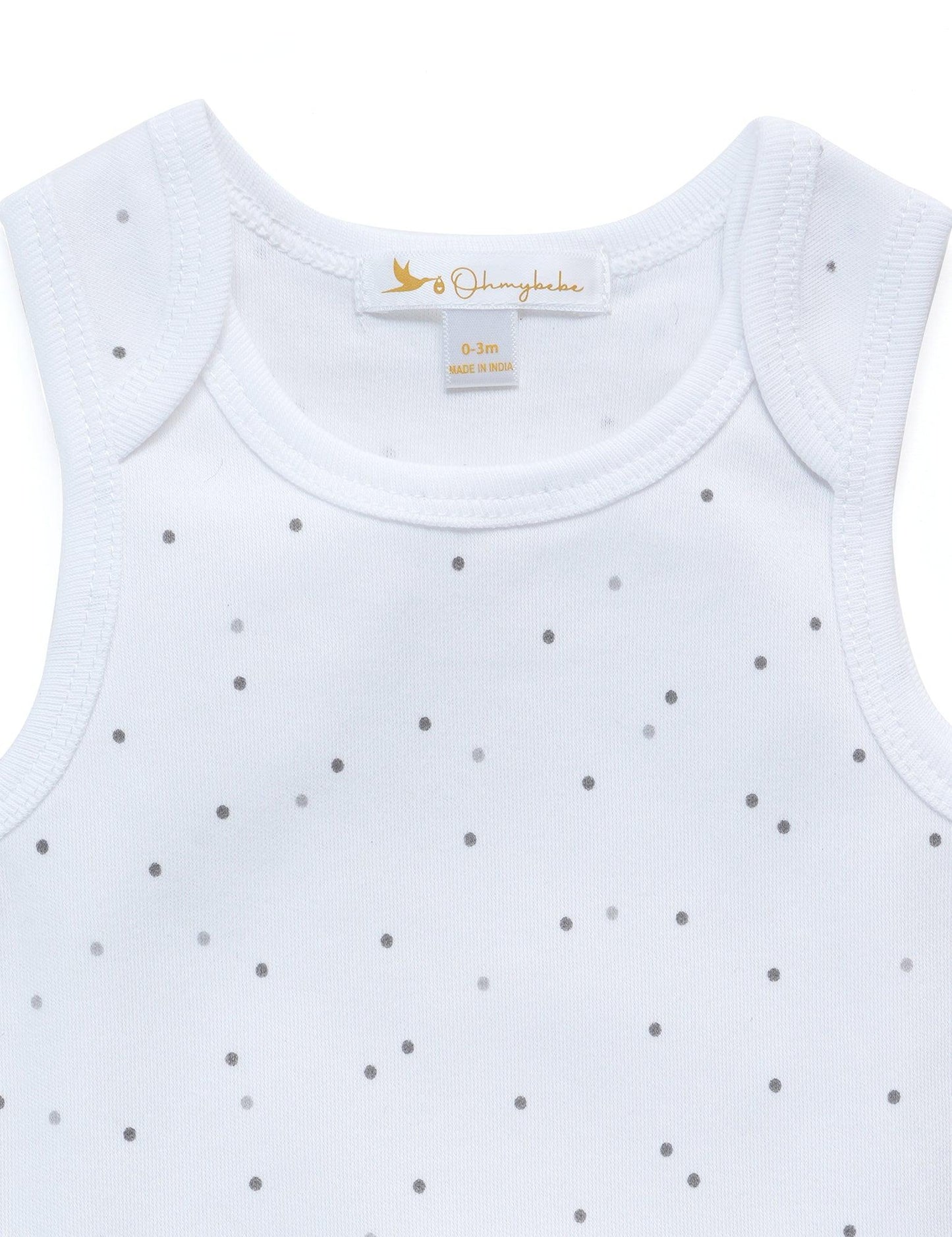 White organic cotton baby tank top with tiny gray polka dots and Ohmybabe label