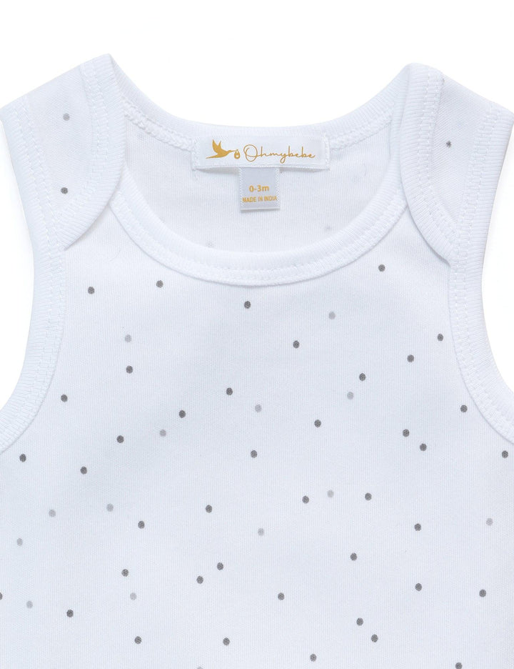 Detail of the white organic cotton sleeveless baby bodysuit showing the round neckline and brand label. Shop quality baby clothing India.