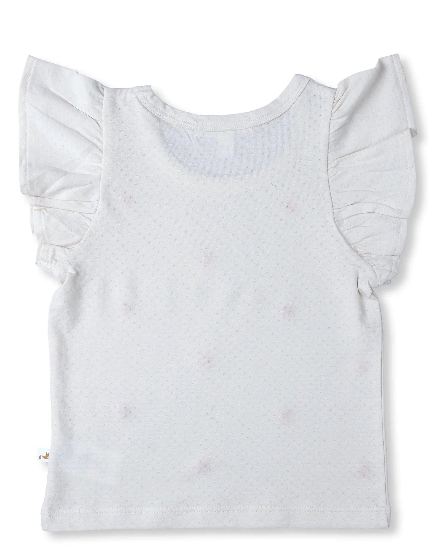 Back view of white organic cotton baby tee with ruffle sleeves and subtle dot pattern