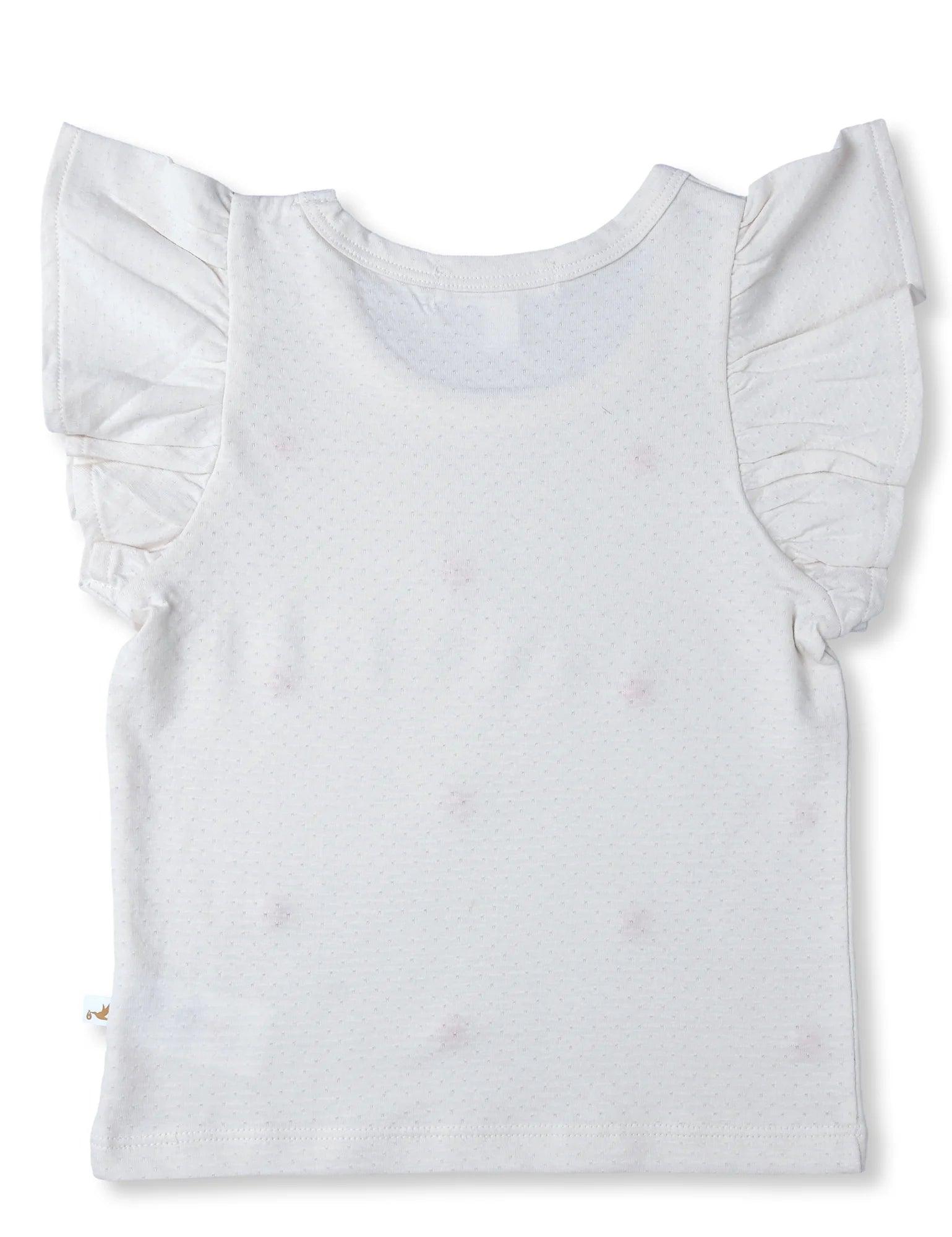 Back view of white organic cotton baby tee with ruffle sleeves and subtle dot pattern