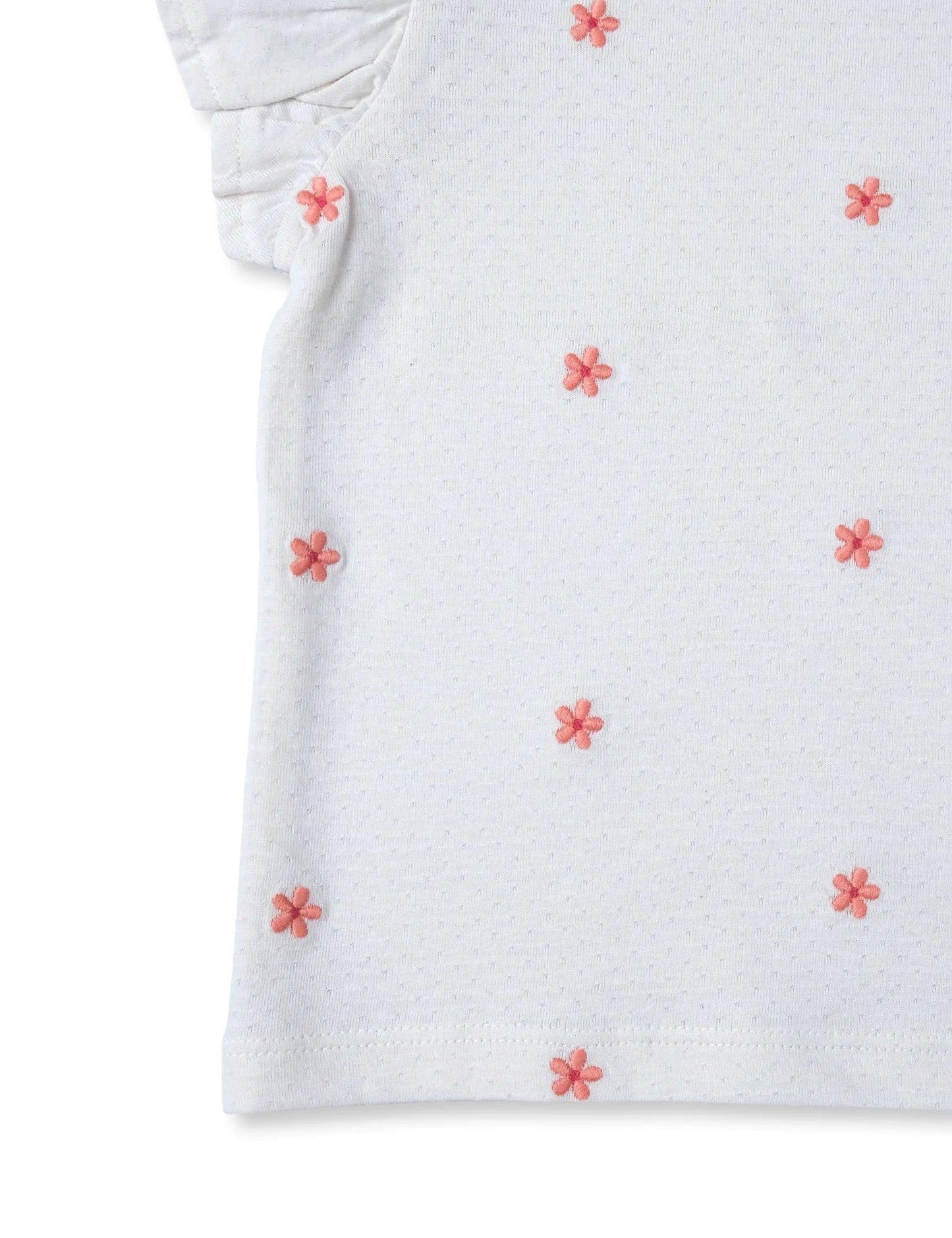 White organic cotton baby tee with pink embroidered flowers and ruffle sleeve detail
