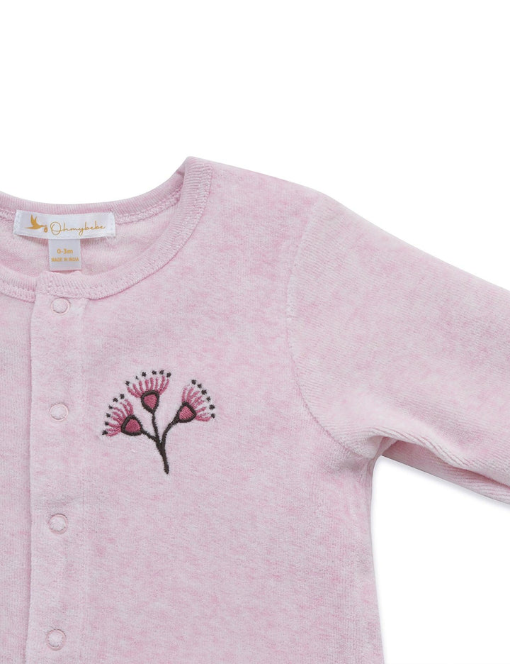 Close-up of the light pink organic cotton baby cardigan highlighting the intricate eucalyptus blossom embroidery detail. Shop unique baby clothing India.
