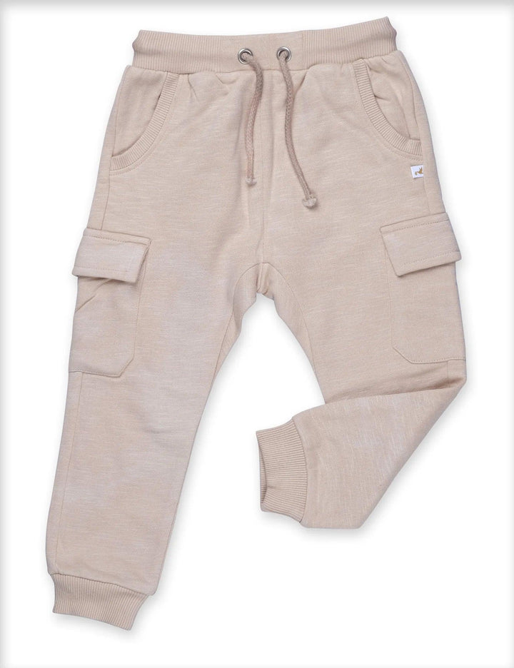 Close-up of the beige organic cotton baby cargo pants showing the elasticated waistband and drawstring. See comfortable baby wear India.