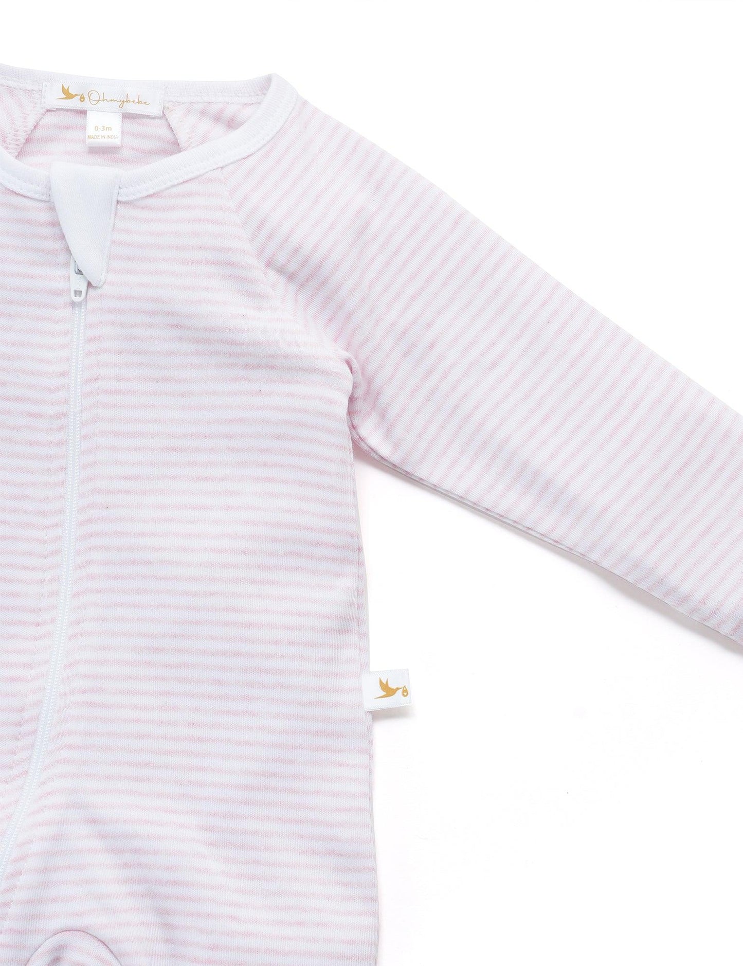 Organic cotton baby footed sleeper in soft pink and white stripes with zipper closure