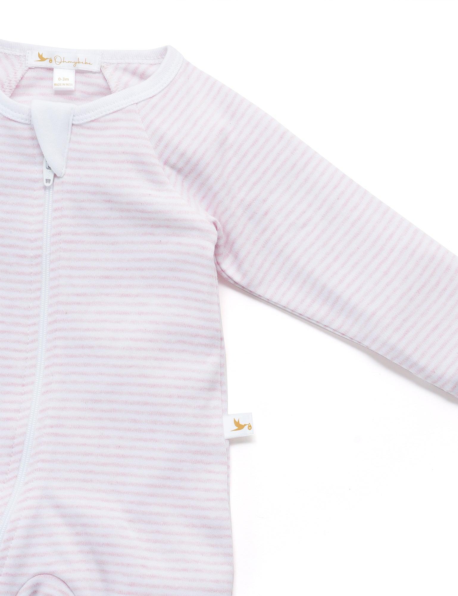 Organic cotton baby footed sleeper in soft pink and white stripes with zipper closure