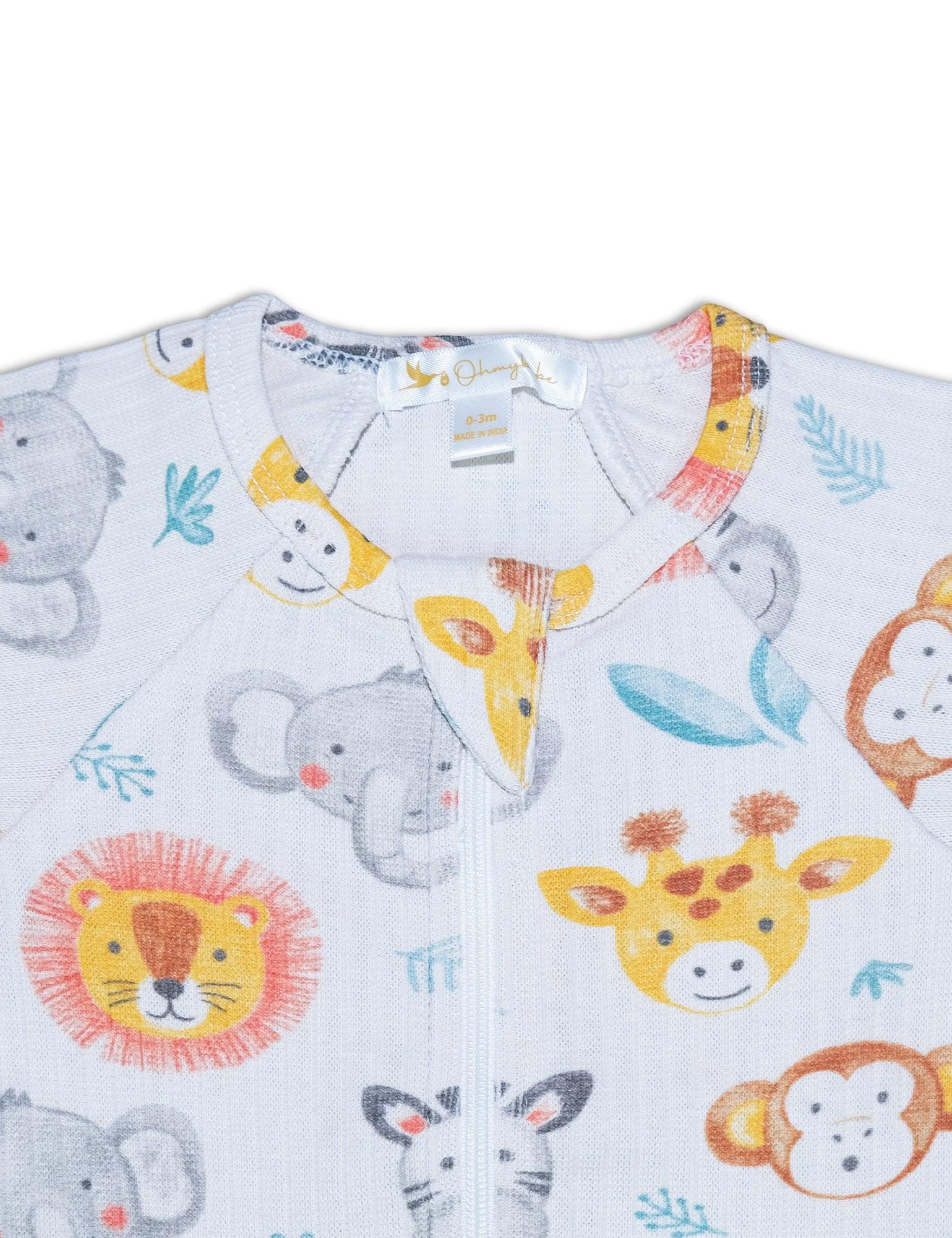 Close-up of organic cotton baby footie with colorful safari animal prints including lion, giraffe, elephant, monkey, zebra