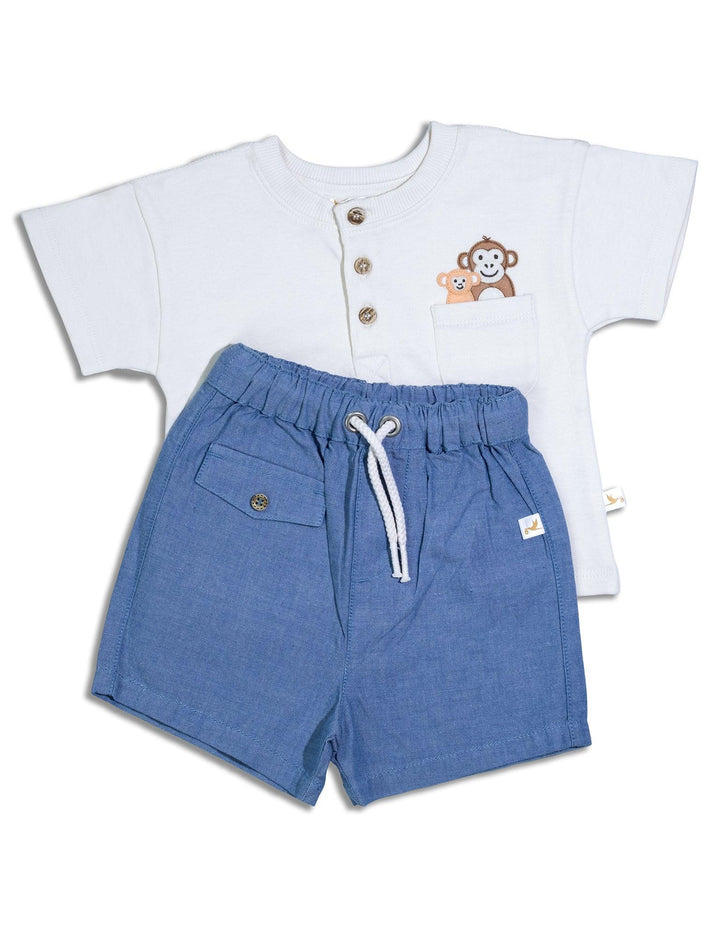 Cream organic cotton short-sleeve henley shirt featuring a sweet monkey and baby monkey in a pocket, paired with soft blue organic cotton shorts. Shop comfy baby wear India.