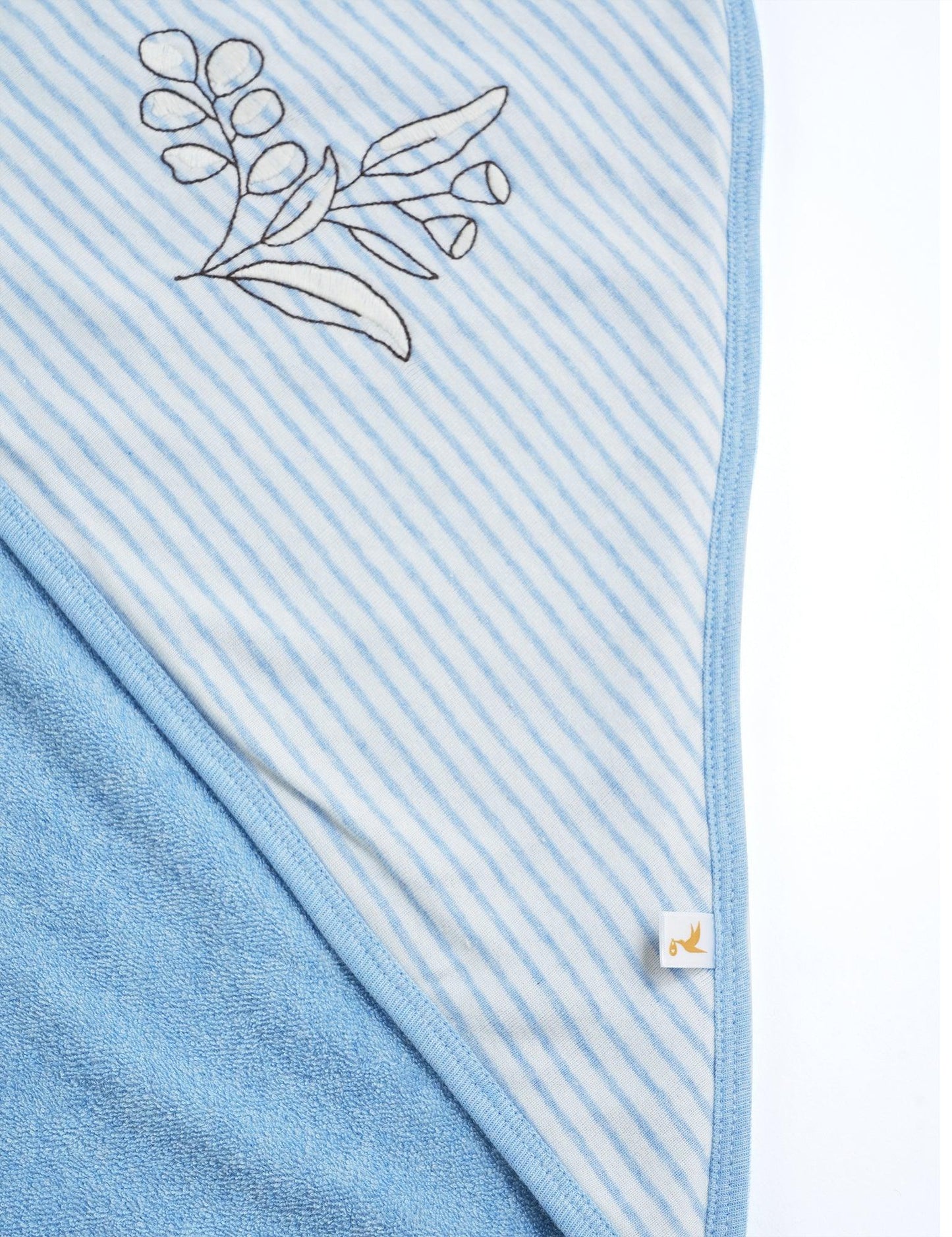Blue and white striped organic cotton hooded towel with botanical embroidery detail