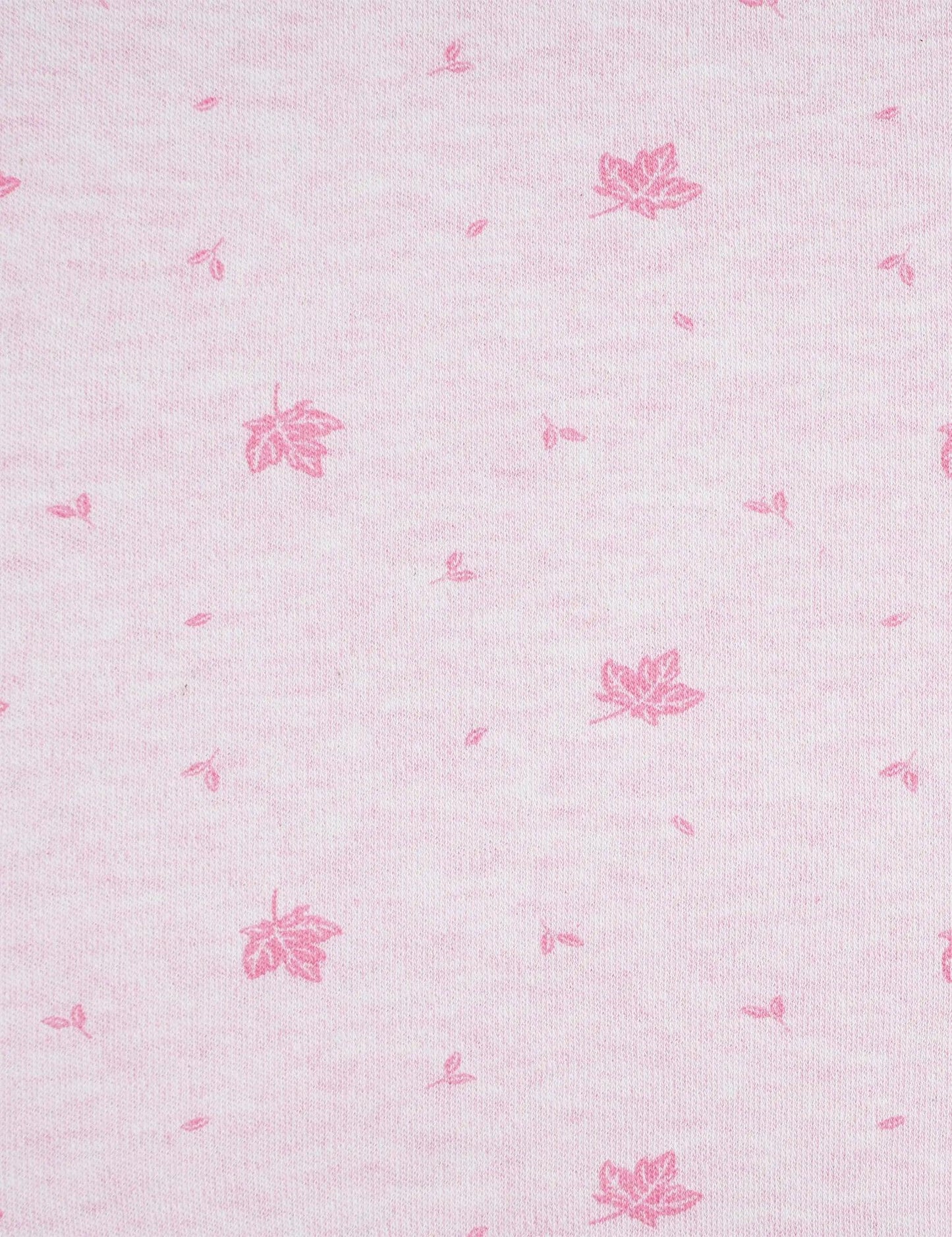 Close-up of pink organic cotton muslin fabric with small printed pink maple leaf and seed patterns