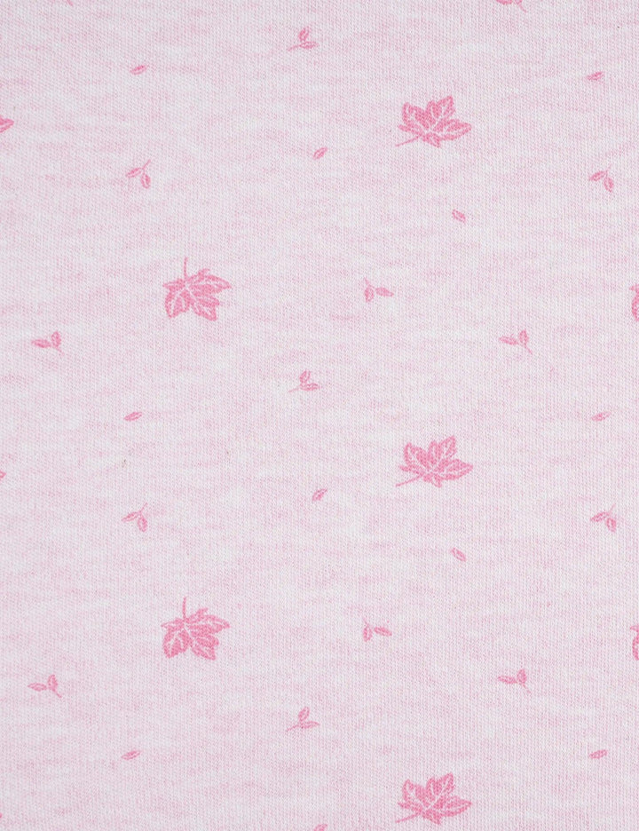  Detailed view of the soft pink organic cotton muslin swaddle fabric with the small maple leaf pattern. Shop breathable baby blankets India.