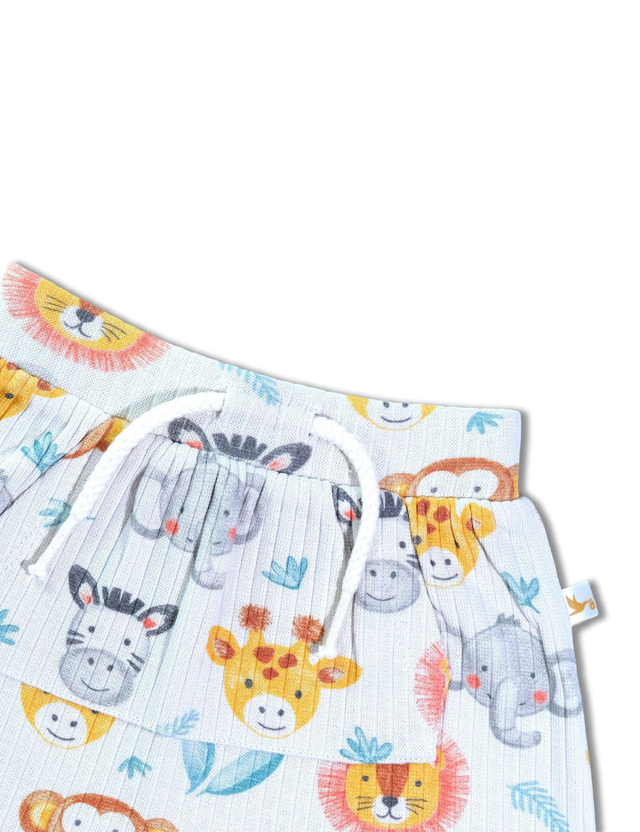Close-up of the white organic cotton baby shorts showing the drawstring waist and the adorable safari animal print details. Shop cute baby bottoms India.