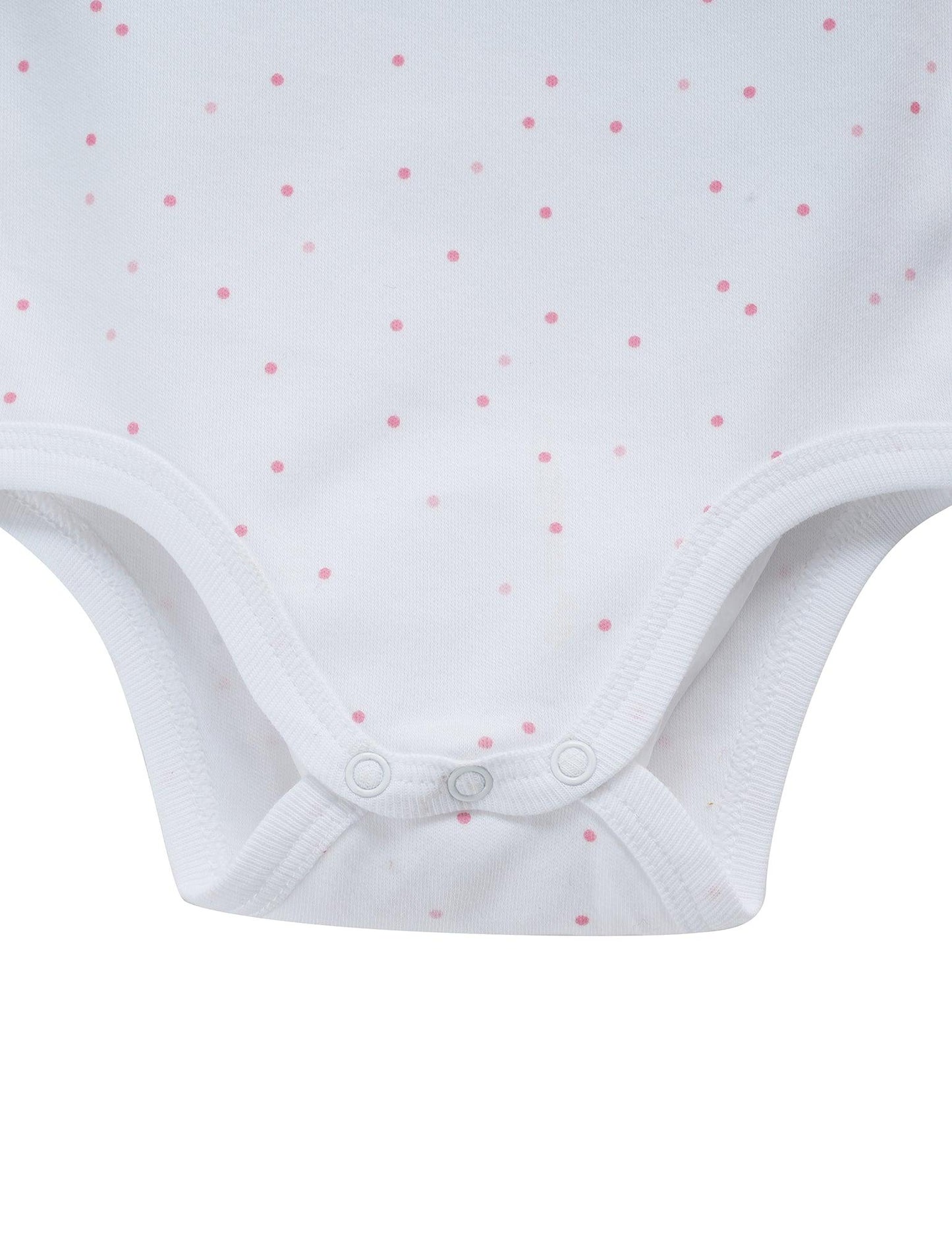 Close-up of white organic cotton baby bodysuit with pink polka dot pattern and snap buttons
