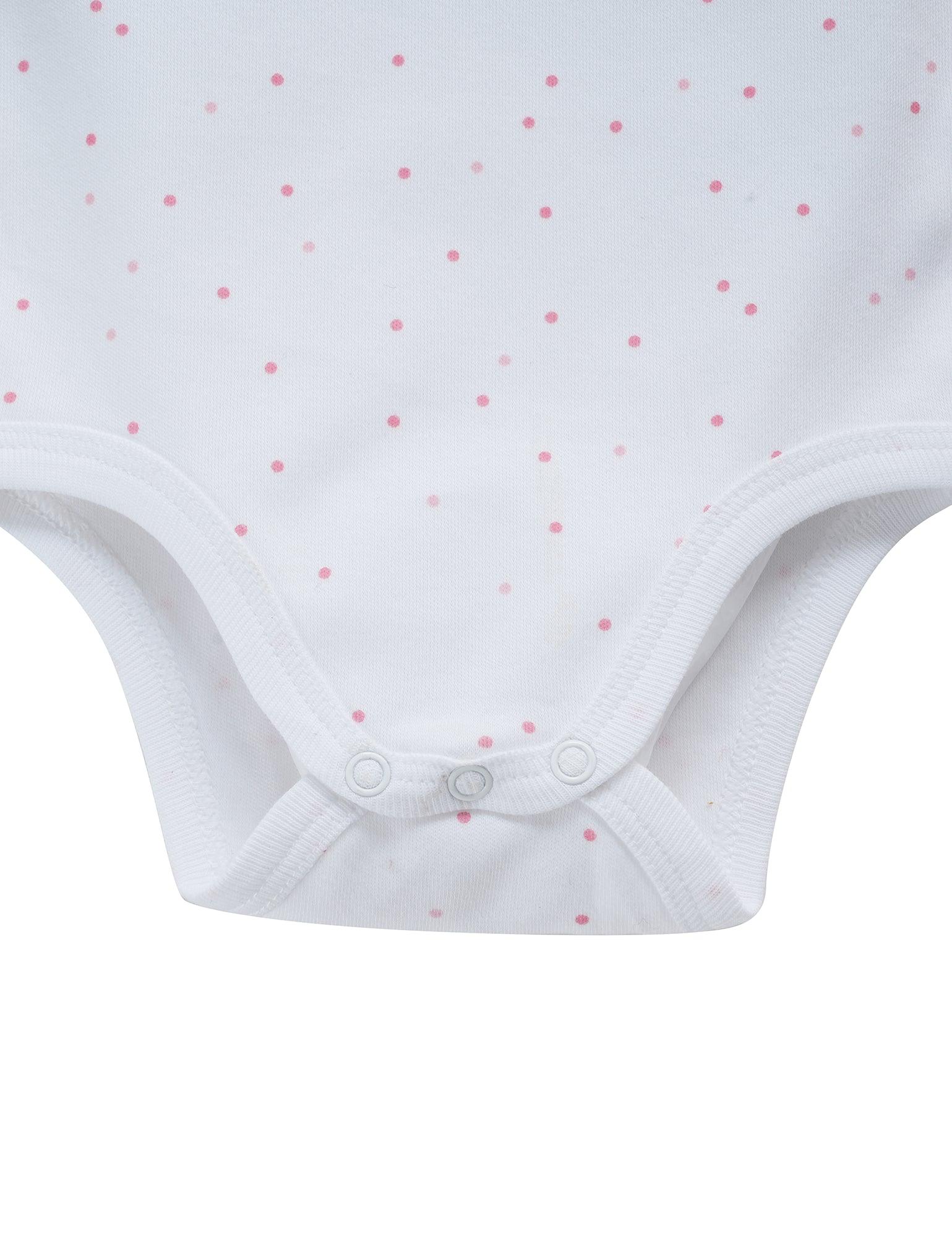 Close-up of white organic cotton baby bodysuit with pink polka dot pattern and snap buttons