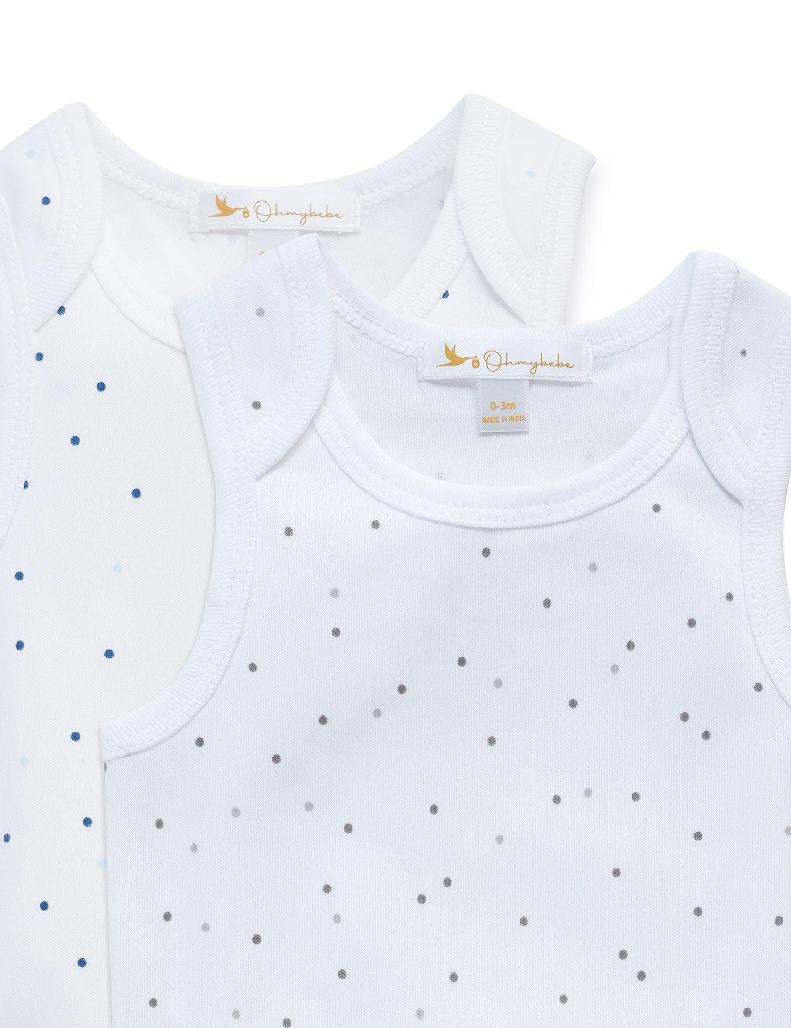 Two organic cotton sleeveless baby bodysuits in white with tiny grey and blue dot patterns