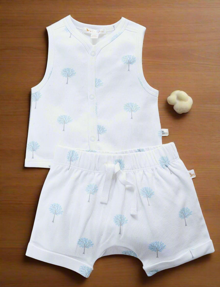 Set of a white organic cotton sleeveless button-up top and matching shorts with a delicate blue winter tree print. Buy comfortable baby sets online India.