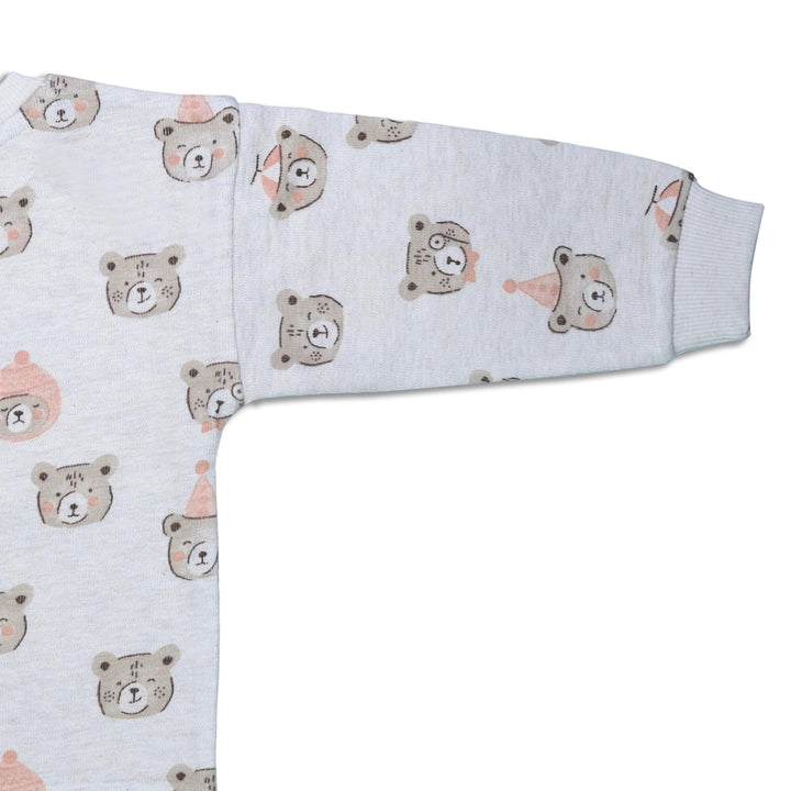 Close-up of the light grey organic cotton sweatshirt sleeve showing the festive bear print and soft ribbed cuff. See organic baby tops India.