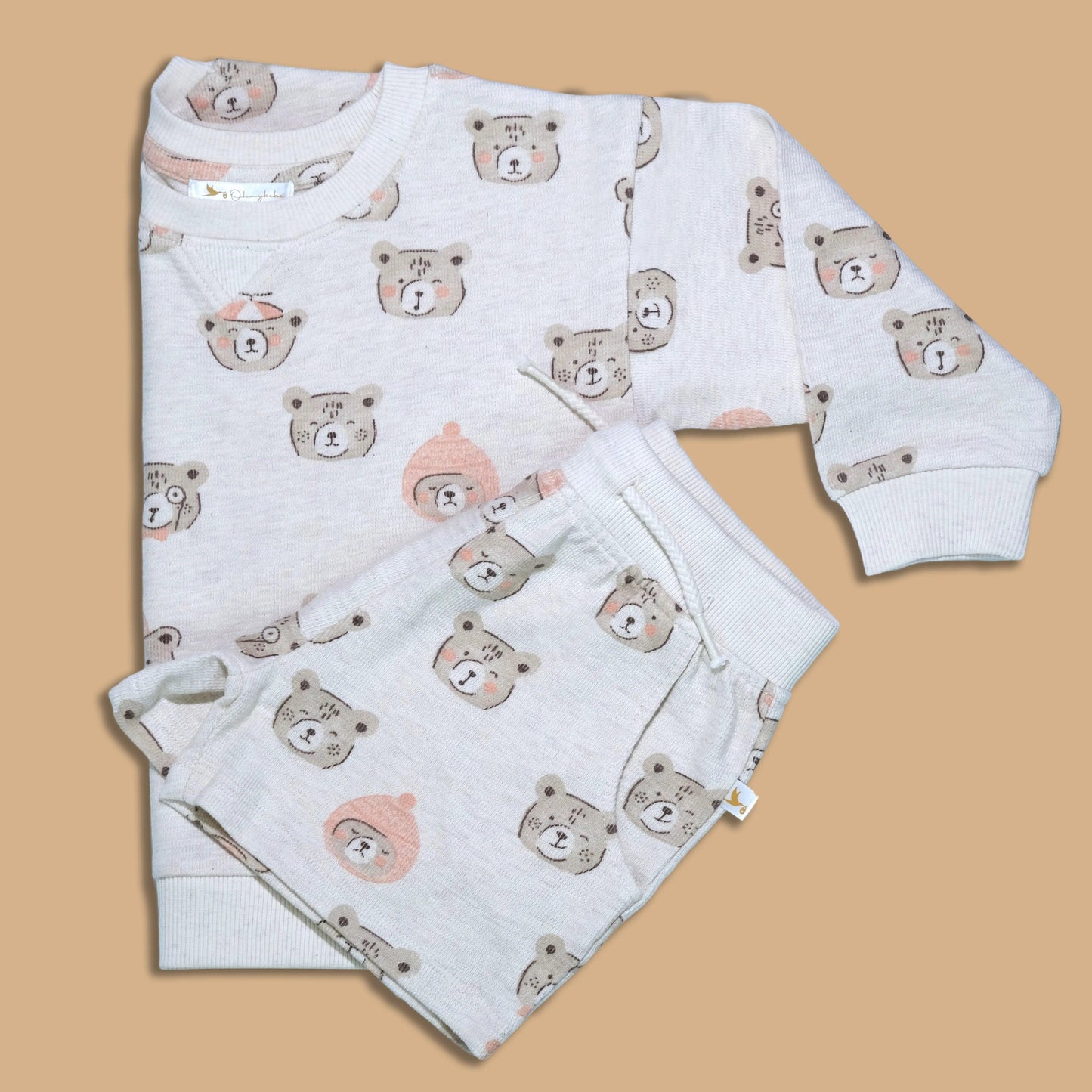 Organic cotton kids sweatshirt and shorts set with cute bear faces print on beige background