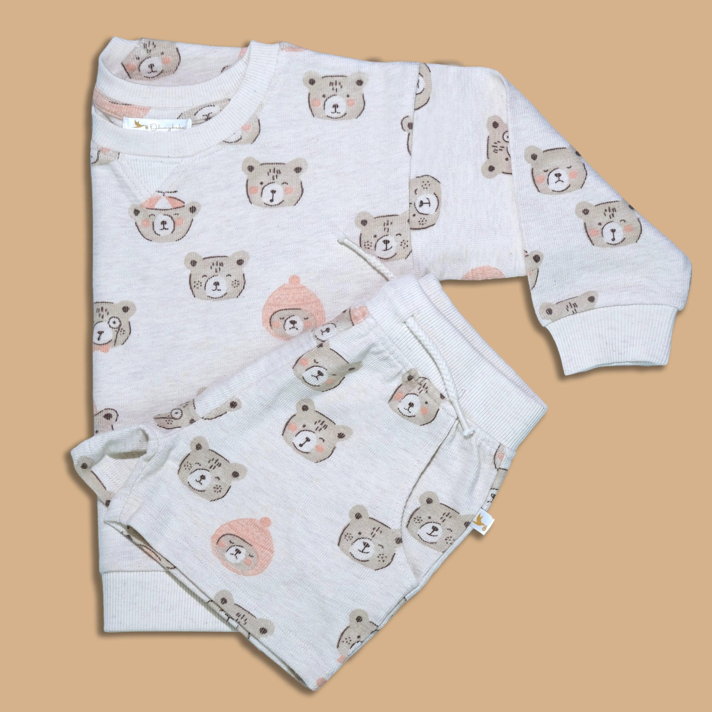 Organic cotton kids sweatshirt and shorts set with cute bear faces print on beige background
