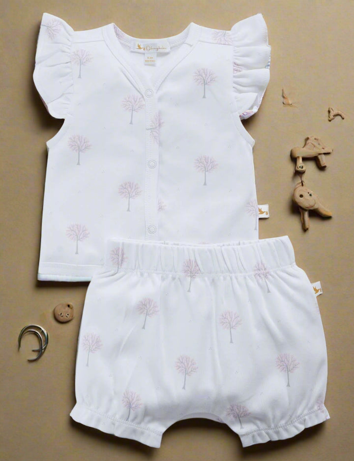 Set of a white organic cotton flutter-sleeve top with a delicate winter tree print, and matching soft bloomers with a ruffled hem. Buy baby clothing sets India.