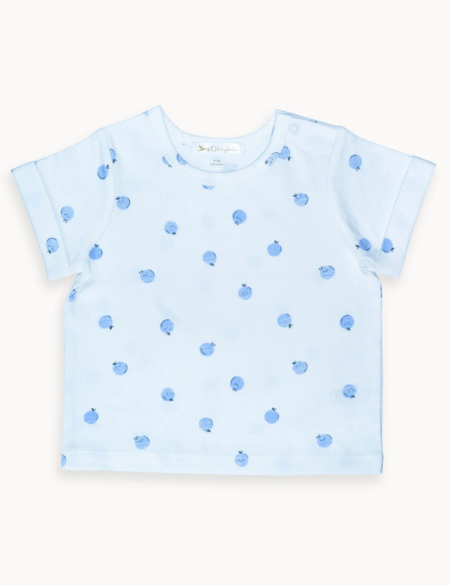 Light blue baby t-shirt with blue apple prints, short sleeves, and snap button detail