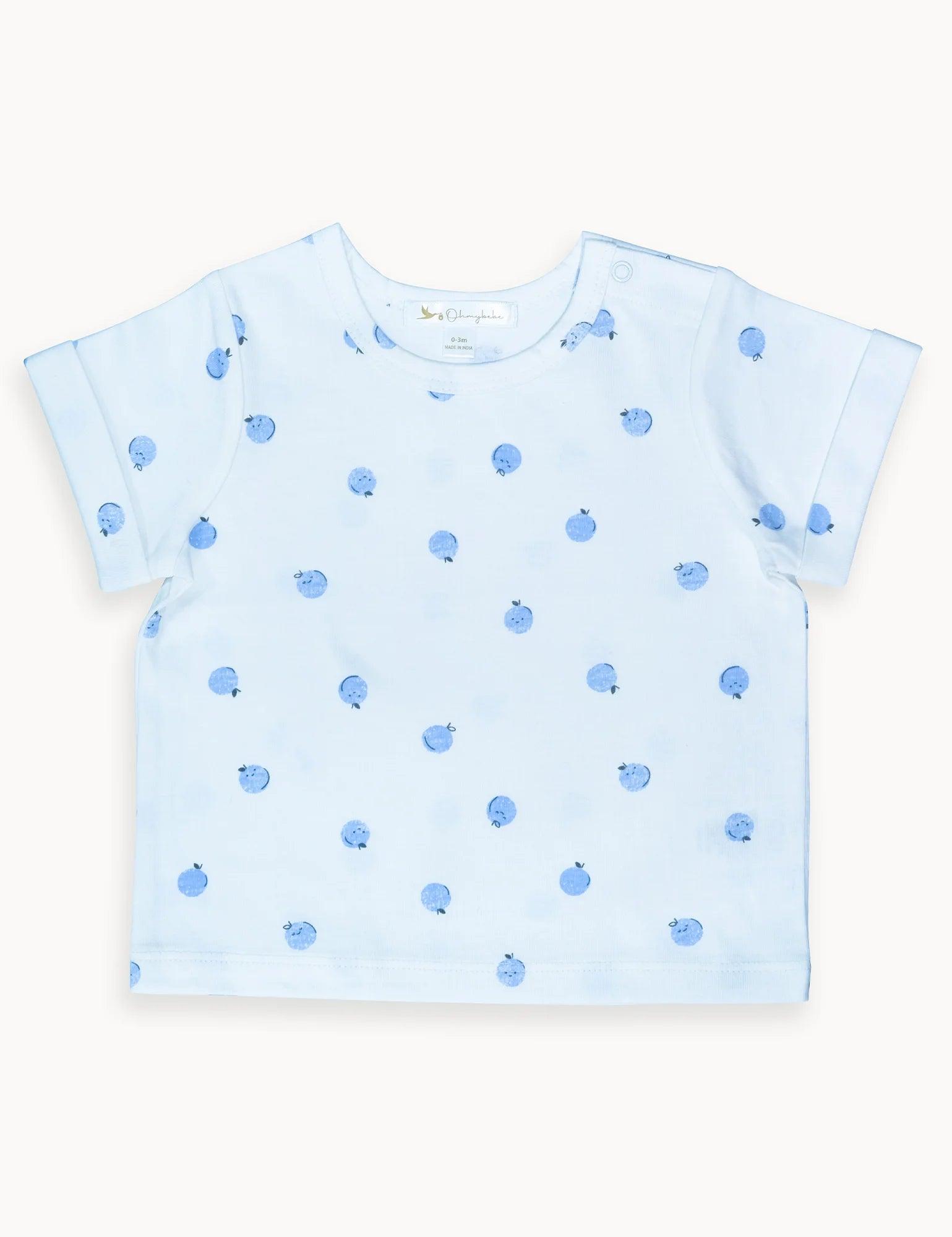 Light blue baby t-shirt with blue apple prints, short sleeves, and snap button detail