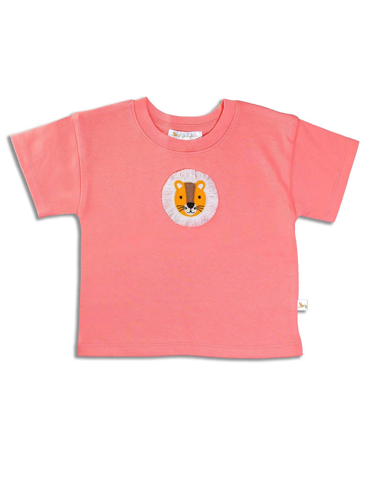 Close-up of the orange organic cotton baby t-shirt showing the textured lion face patch in detail. See unique baby tops India.