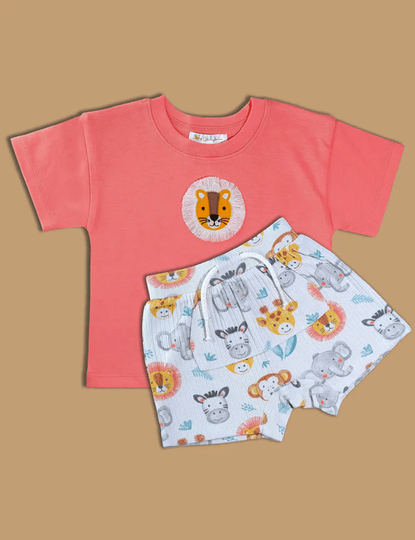 Set includes an orange organic cotton short-sleeve t-shirt with a charming lion face patch and soft white shorts with a colorful safari animal print. Buy baby clothing sets India.