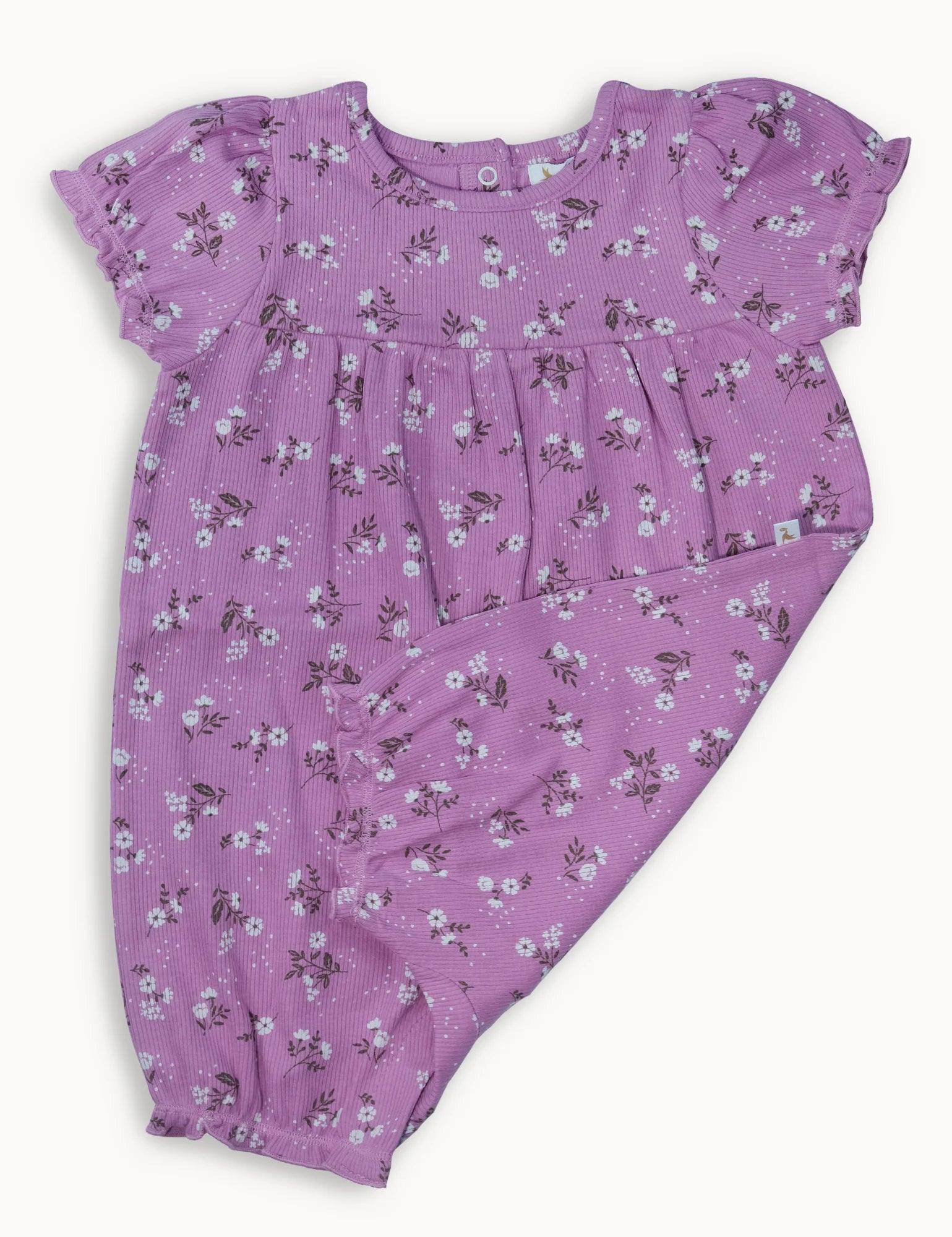 Purple baby romper with white daisy floral print and ruffled short sleeves