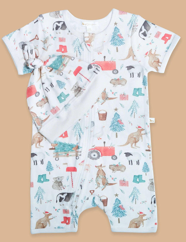 Shortie Zip Growsuit & Knot Hat – Farm Joy Print. A 100% organic cotton short-sleeved baby zip-up romper featuring a playful farm animal and Christmas-themed print with kangaroos in Santa hats, cows, sheep, and Christmas trees. Buy organic cotton baby sleepwear online in India.