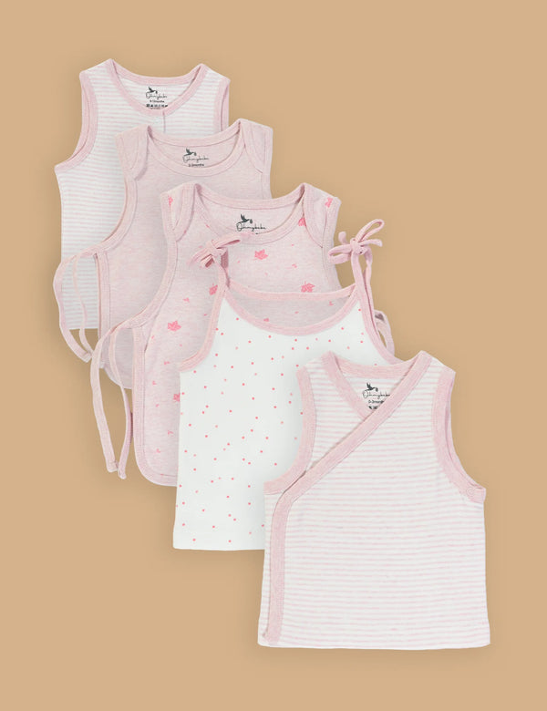 A set of five Purebaby organic cotton baby singlets in various soft pink and white designs including stripes and polka dots. Shop gentle baby undershirts online in India.