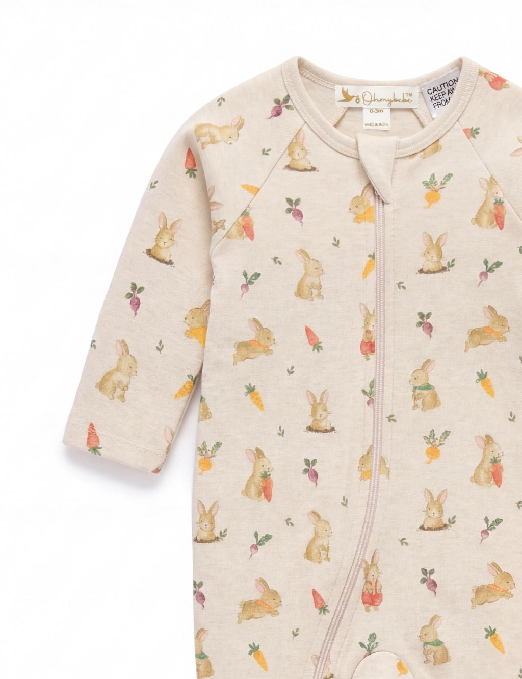 Sleeve and chest detail of a beige baby zip-up romper featuring cute bunny prints.