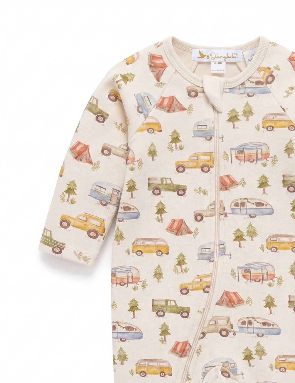 Close-up detail of the sleeve and chest on an organic cotton baby romper showing the camping and camper van print.