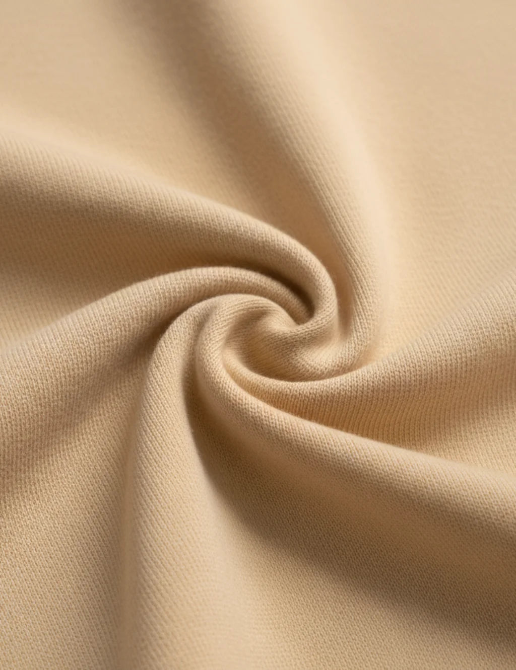 Close-up of beige fabric with folds