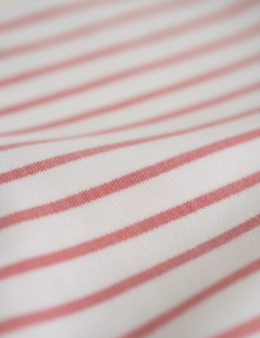 Close-up of fabric with red and white horizontal stripes