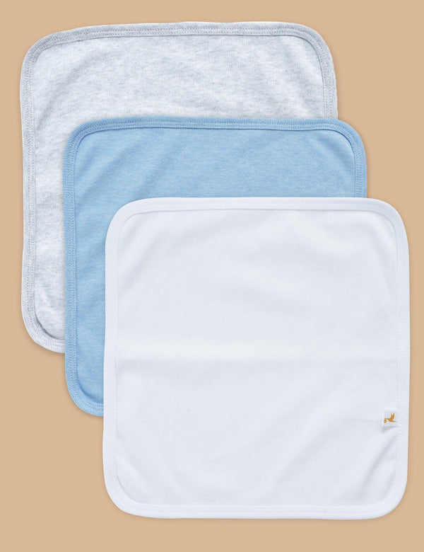 A set of three soft organic cotton baby washcloths in light grey, light blue, and white. Gentle for baby's sensitive skin. Buy baby washcloths India.